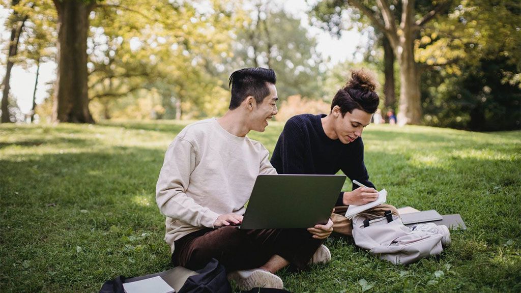 Student studying outside for exam preparation