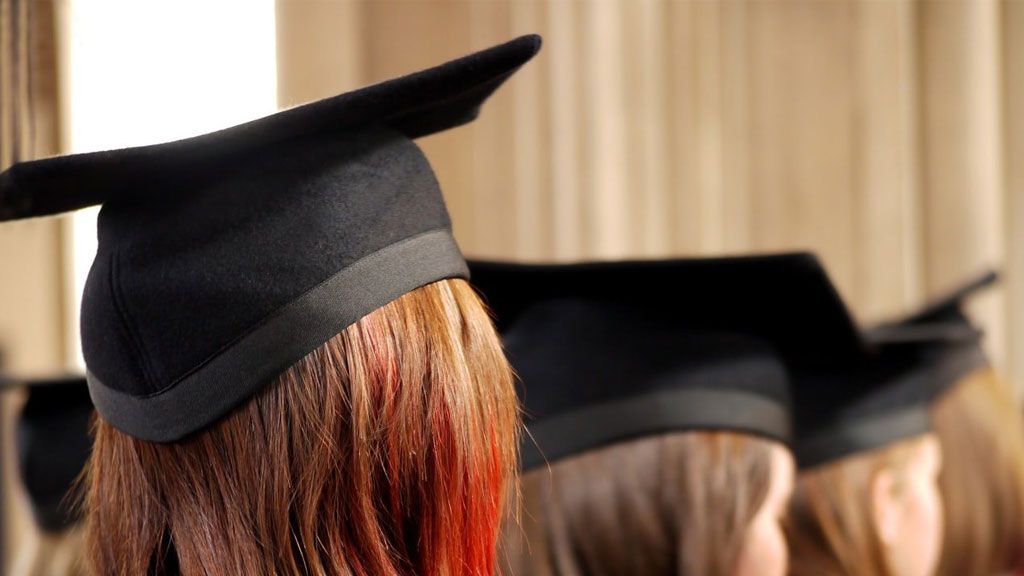 Graduate with diploma