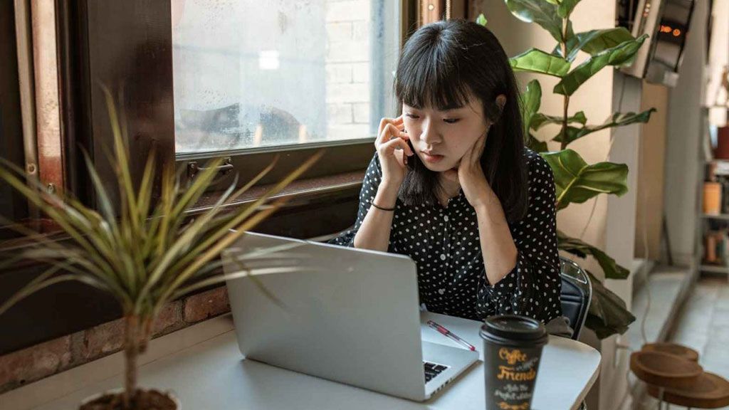 Female student studying on laptop
