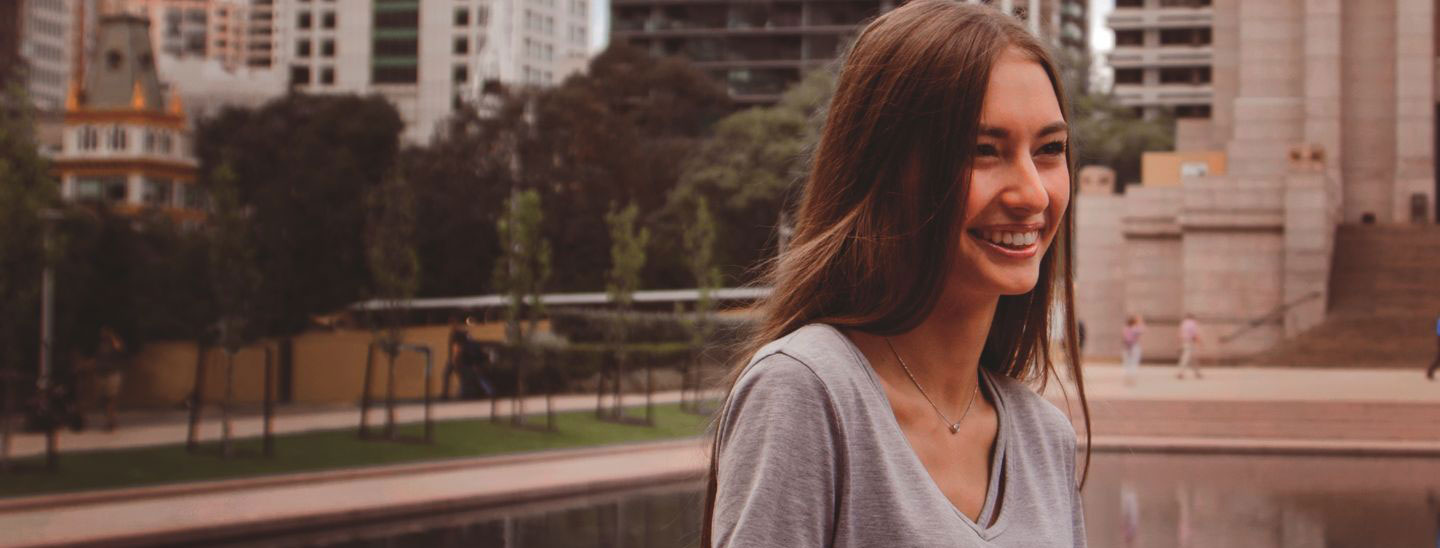 Campus female student smiling