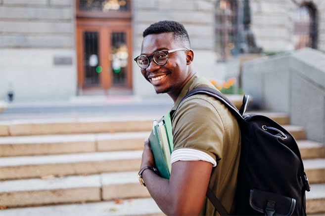 Campus student male holding books