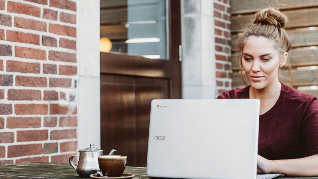 Female using laptop outside