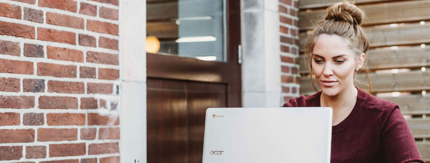 Female using laptop outside