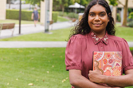 Student female smiling with books